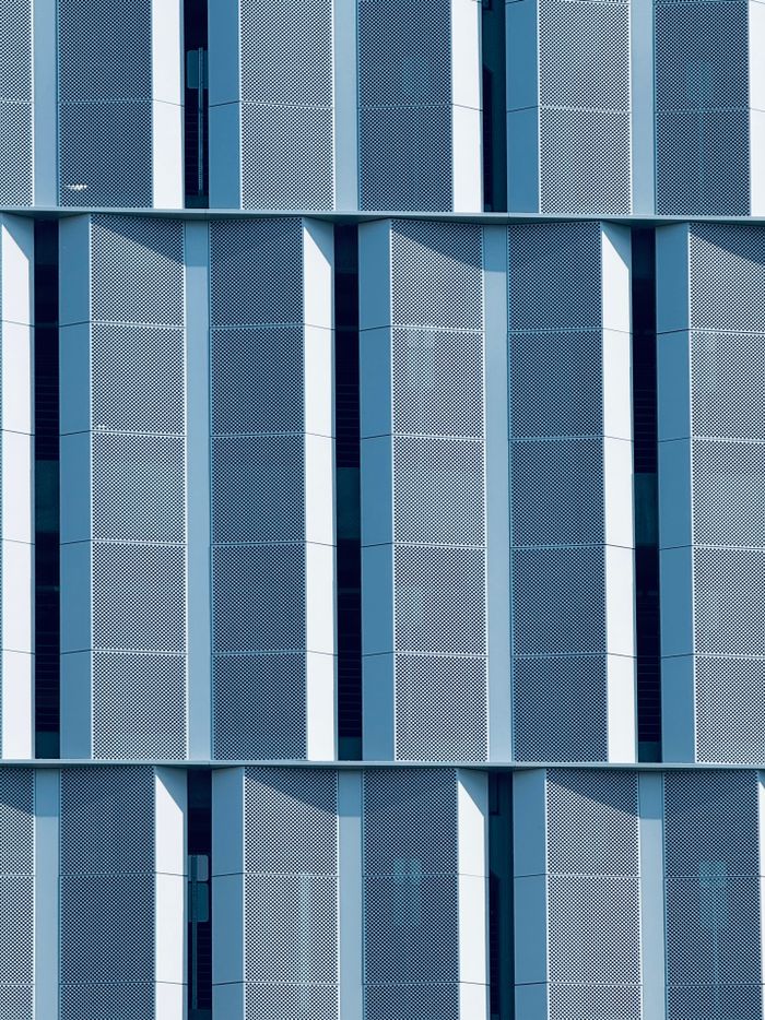 Abstract view of a geometric building facade in Boston, showcasing modern architecture with vertical patterns.